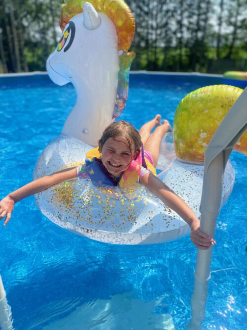 Girl Swimming in Pool from Hearth & Home Utica NY